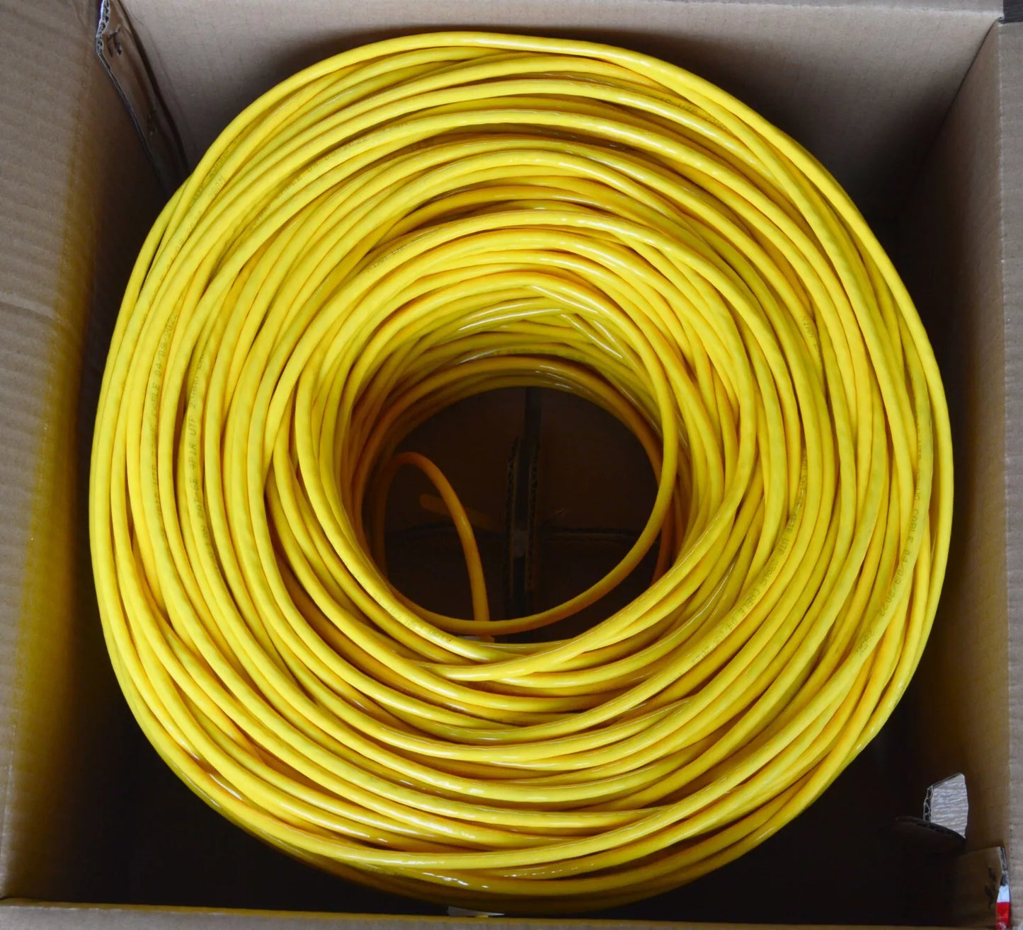 Dahua UTP CAT6 Cable 305M in yellow color coiled inside a cardboard box.